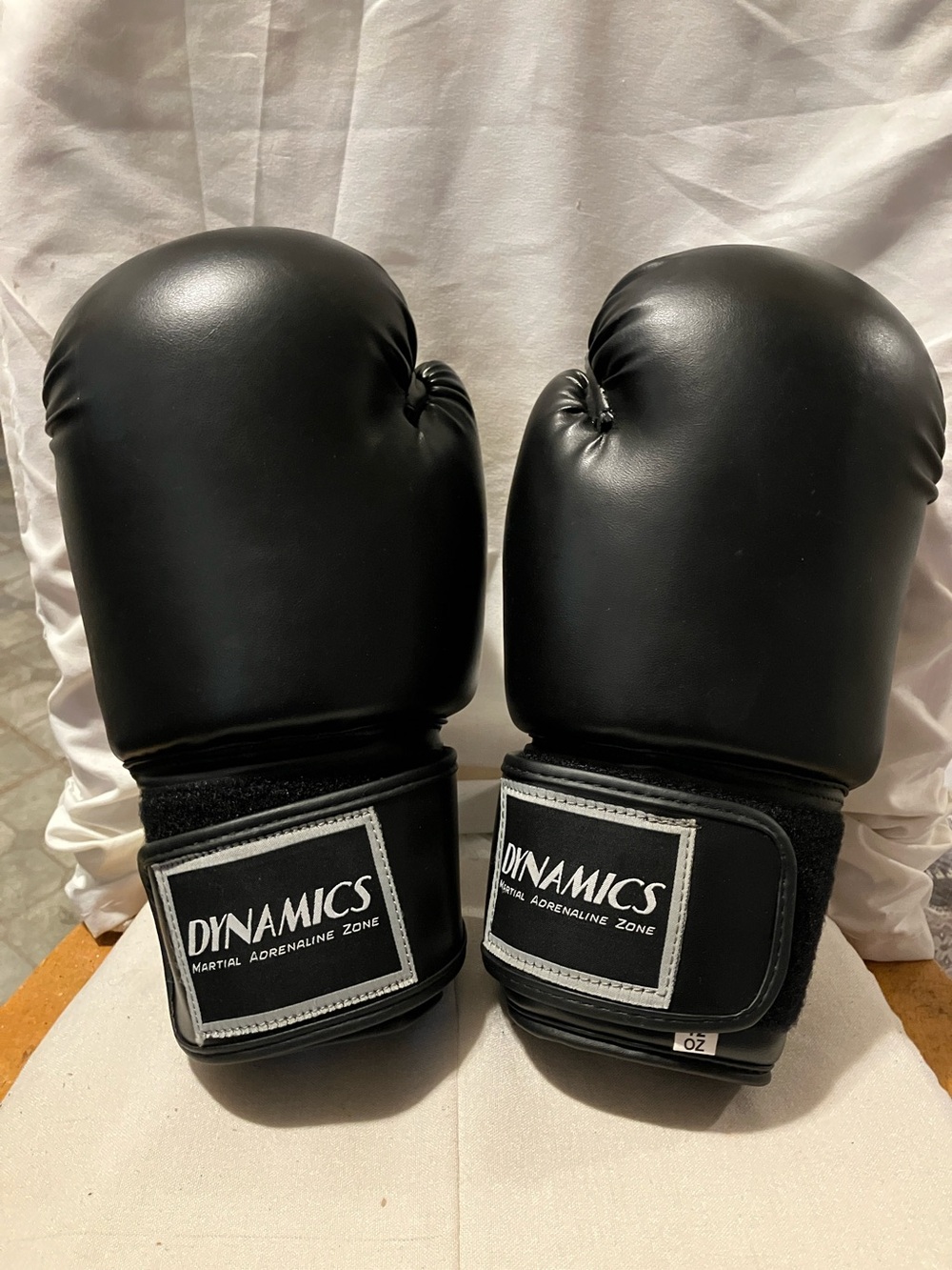 Like new. Black adult size boxing gloves by Dynamics Martial Arts. Perfect